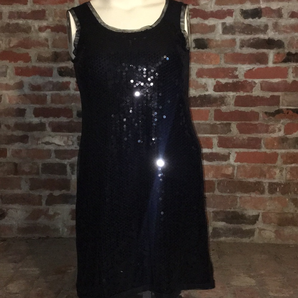 Sleeveless black sequin dress with mesh over lay